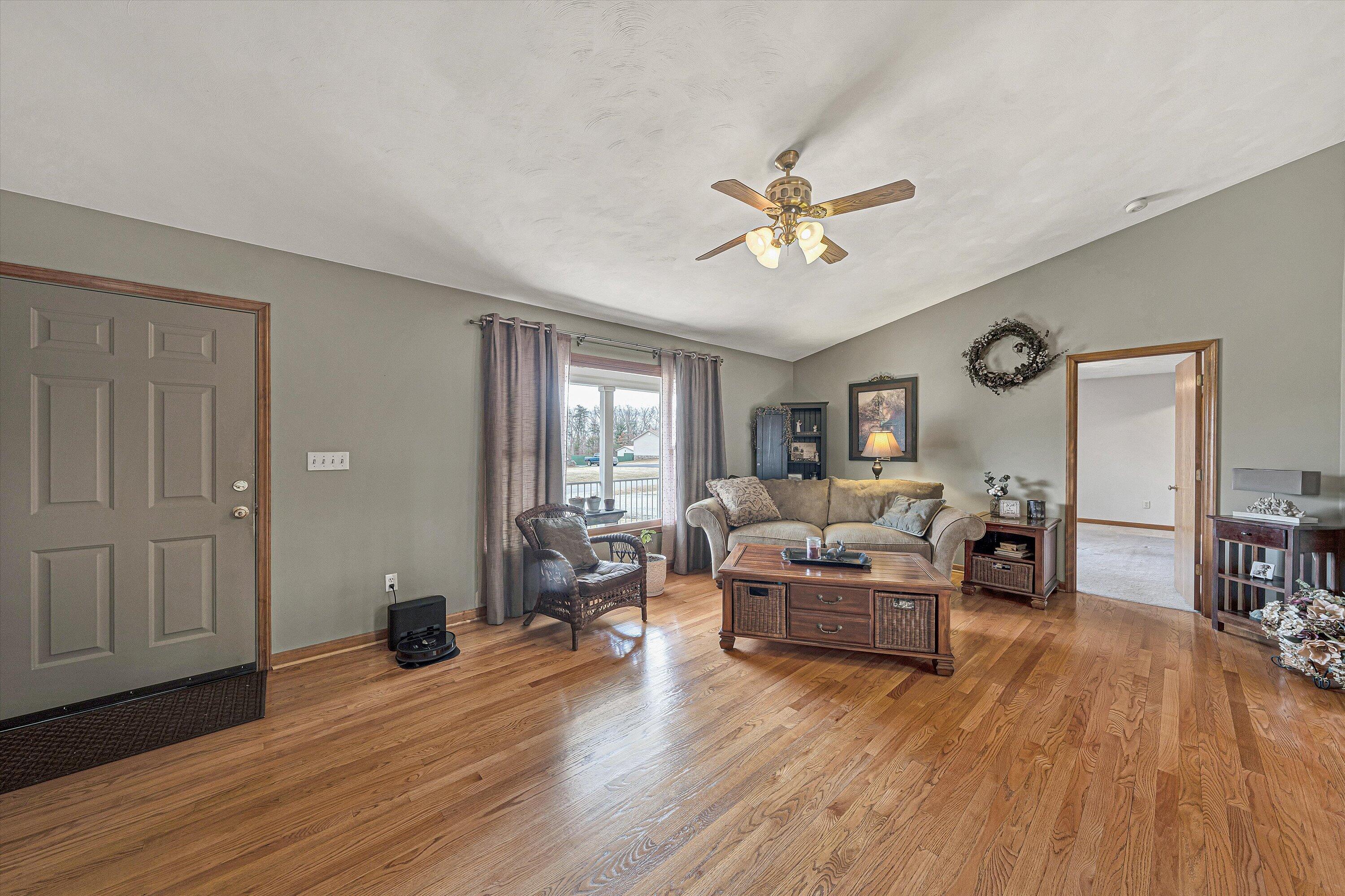 460 Stonybrook Road Wirtz, VA 24184 - Photo 9 of 44 a living room with furniture and a wooden floor
