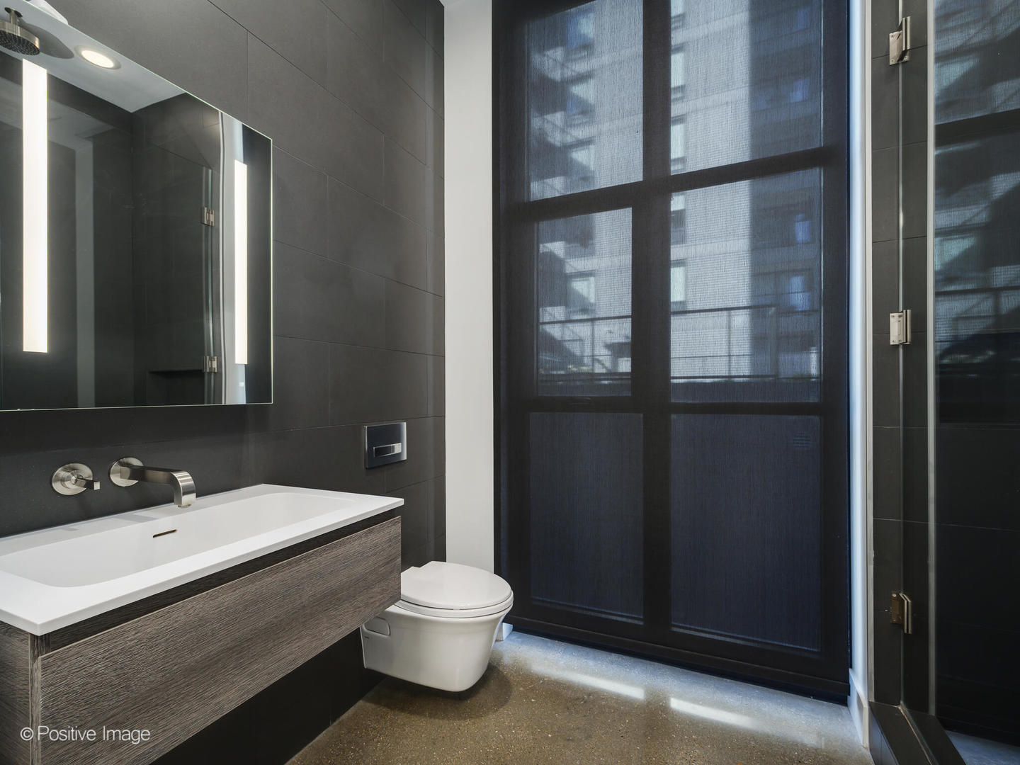 Undisclosed Address Chicago, IL 60607 - Photo 17 of 18 a bathroom with a sink and a mirror