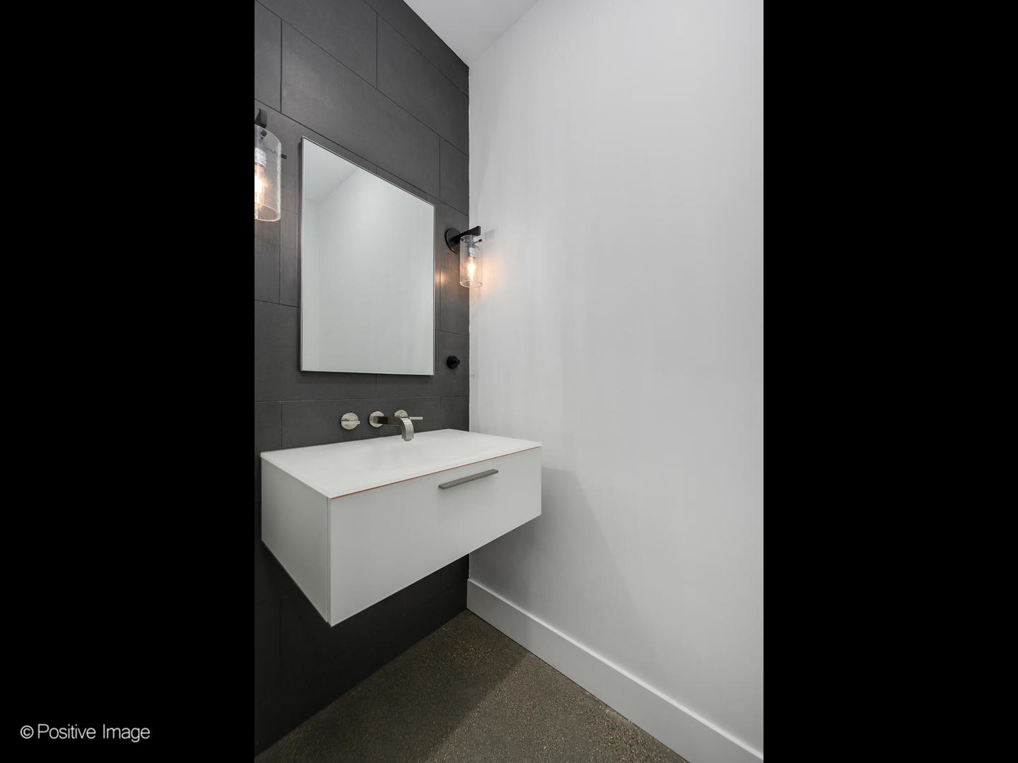 Undisclosed Address Chicago, IL 60607 - Photo 8 of 18 a bathroom with a sink and a mirror
