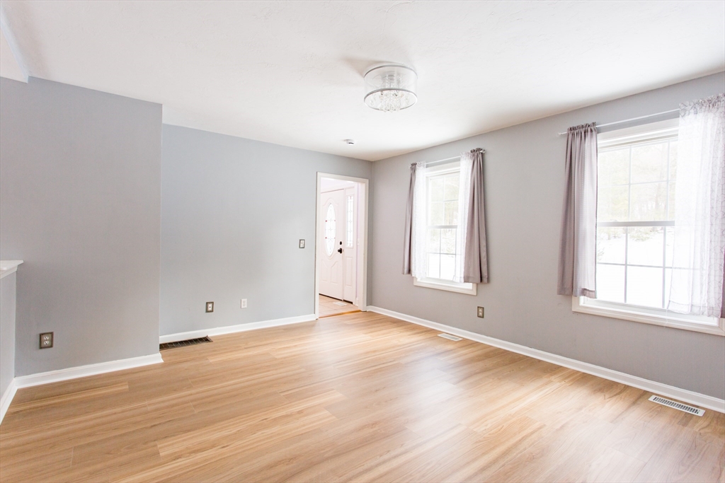 270 New Braintree Road West Brookfield, MA 01585 - Photo 14 of 37 an empty room with wooden floor and windows