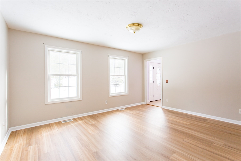 270 New Braintree Road West Brookfield, MA 01585 - Photo 19 of 37 an empty room with wooden floor and windows