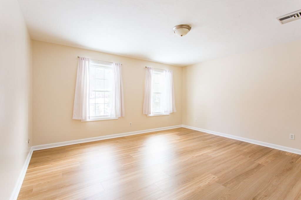 270 New Braintree Road West Brookfield, MA 01585 - Photo 20 of 37 an empty room with wooden floor and windows