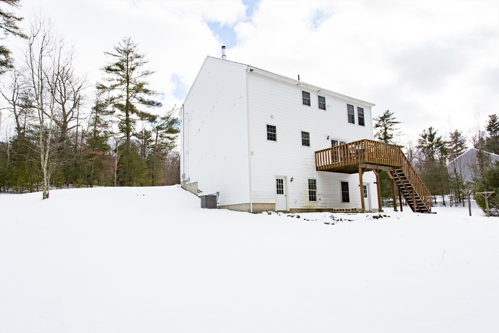 270 New Braintree Road West Brookfield, MA 01585 - Photo 7 of 37 a view of a white house with snow