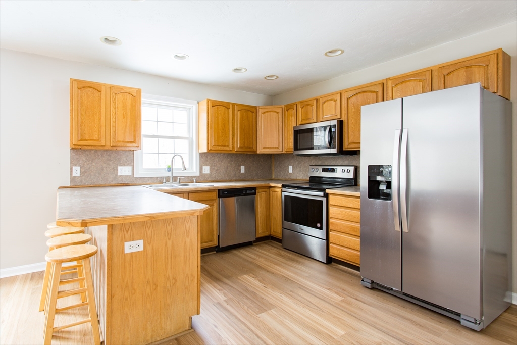 270 New Braintree Road West Brookfield, MA 01585 - Photo 9 of 37 a kitchen with granite countertop a refrigerator stove top oven and sink