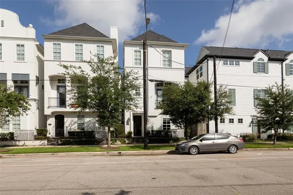 a view of a parked cars in front of a building