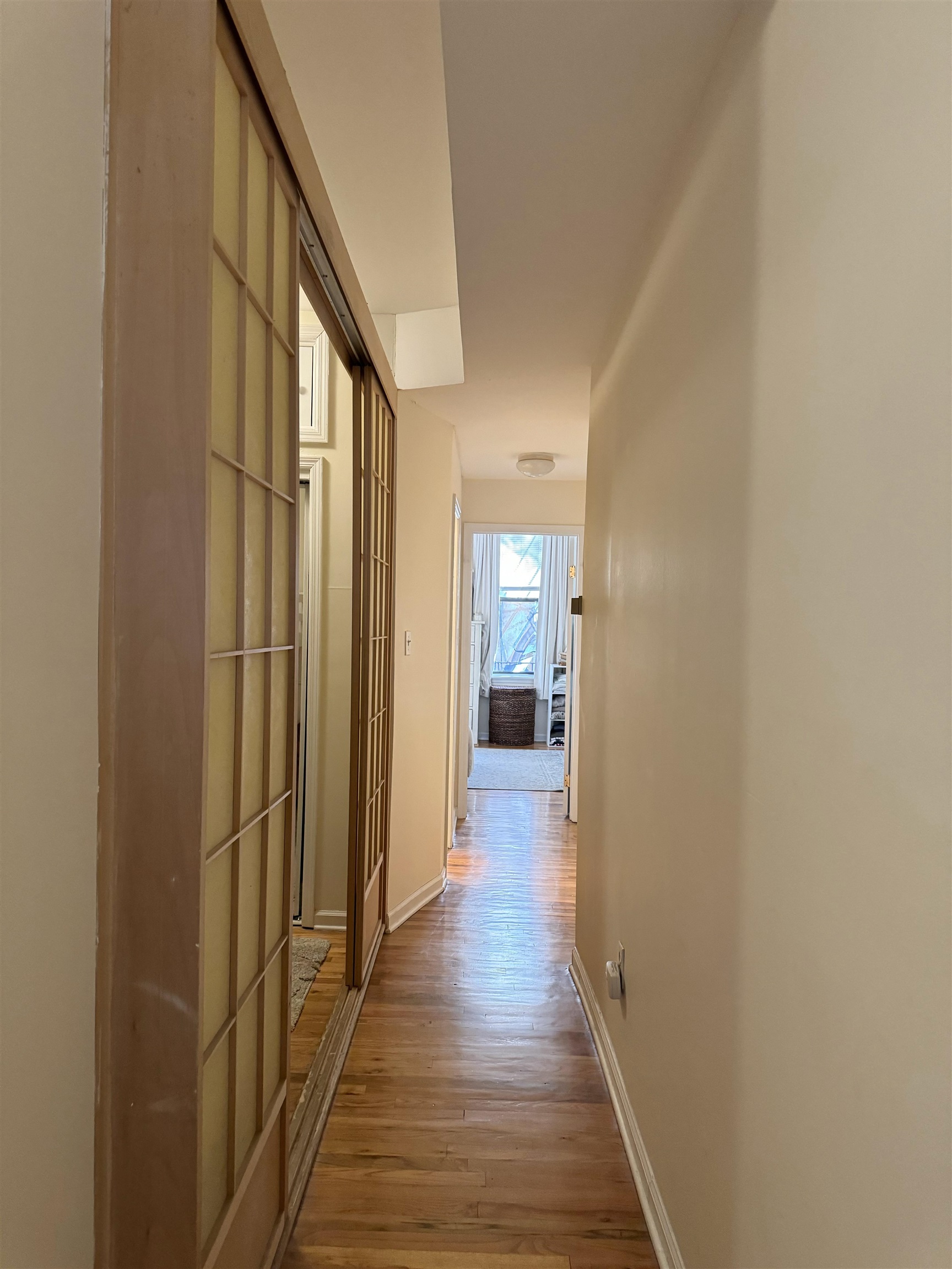 155 14th Street, Unit 2L Hoboken, NJ 07030 - Photo 11 of 13 a view of a hallway with wooden floor