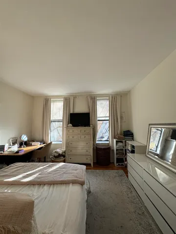 a bedroom with furniture or couch and a window