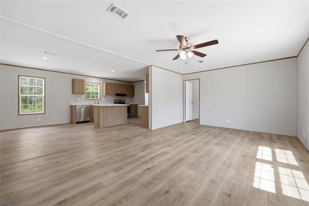 150 19th Street Interlachen, FL 32148 - Photo 10 of 30 a view of a livingroom with a window and wooden floor