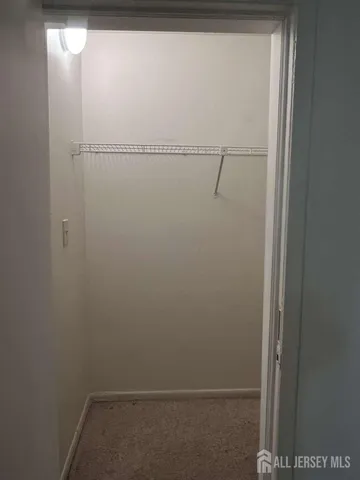 a view of small space with racks on the wall