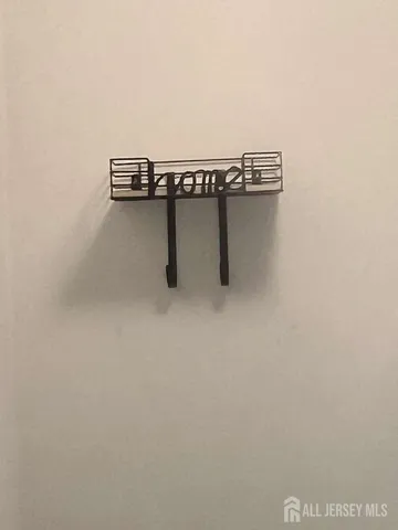 a view of a room with a table and chairs