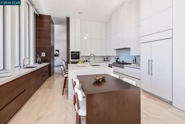 a kitchen with a stove a sink and a microwave