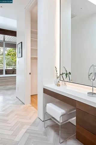 a lobby with a bed and a potted plant