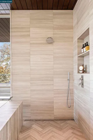 a kitchen with a table chairs stove and wooden floor
