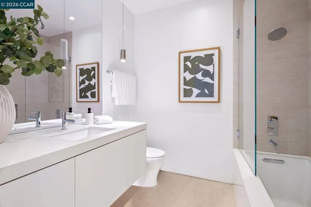 a bedroom with two beds and glass window