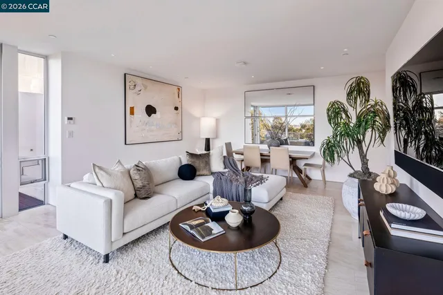 a bathroom with a sink a toilet a mirror and shower