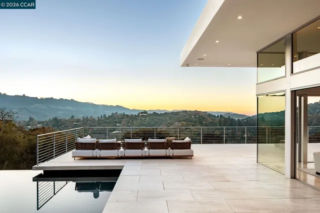 a view of balcony with furniture
