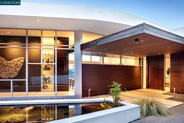 a balcony with furniture and wooden floor
