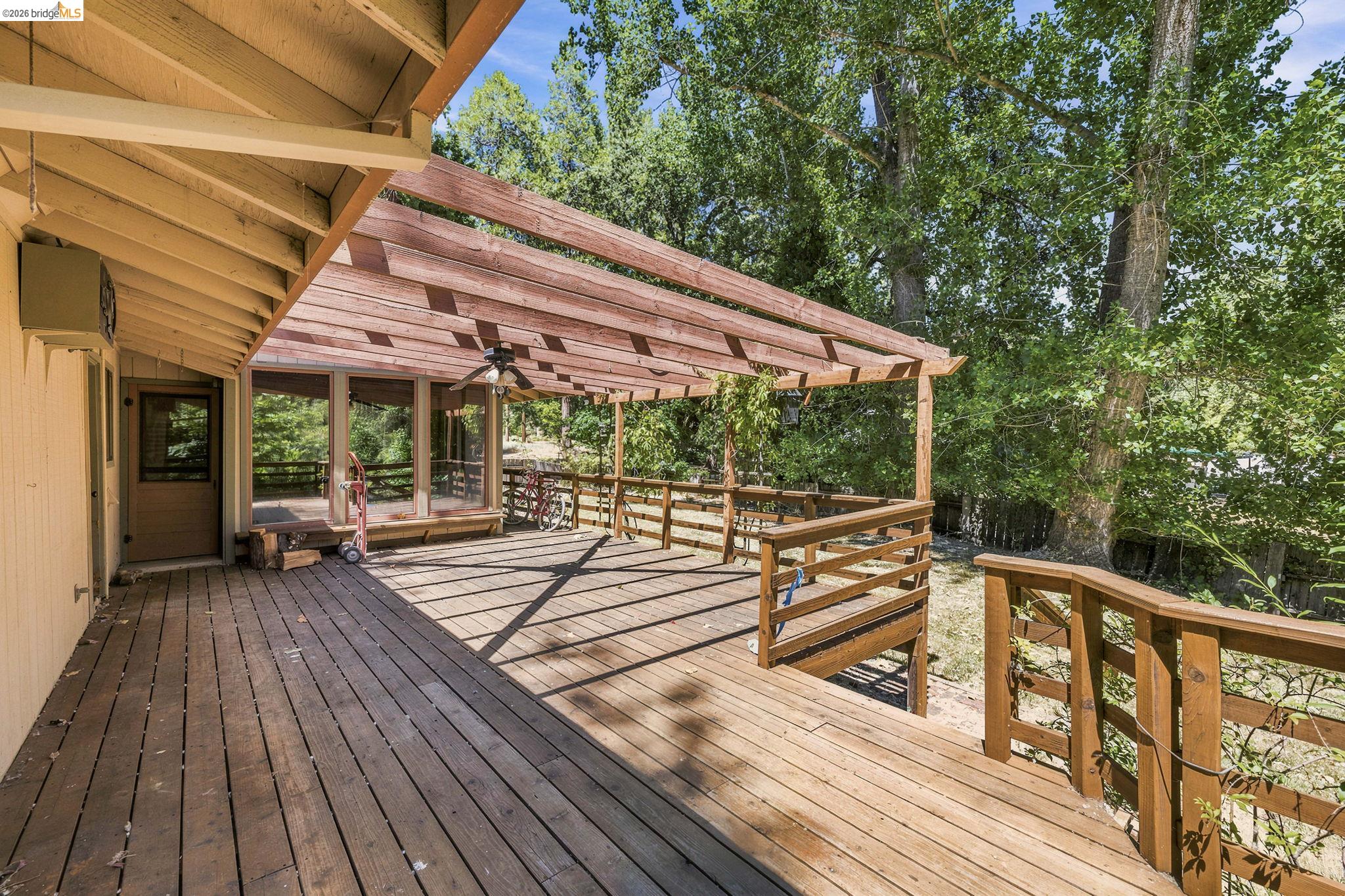 22401 South Fork Road Sonora, CA 95370 - Photo 6 of 34 Expansive wood deck with a partial pergola covering