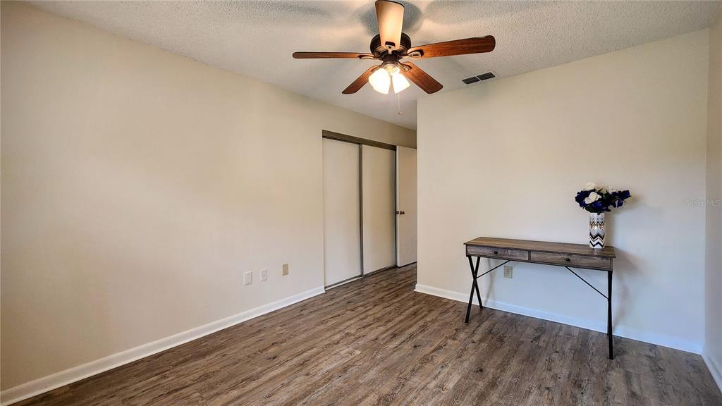 6440 Spring Flower Drive, Unit 14 New Port Richey, FL 34653 - Photo 13 of 35 a view of empty room with wooden floor