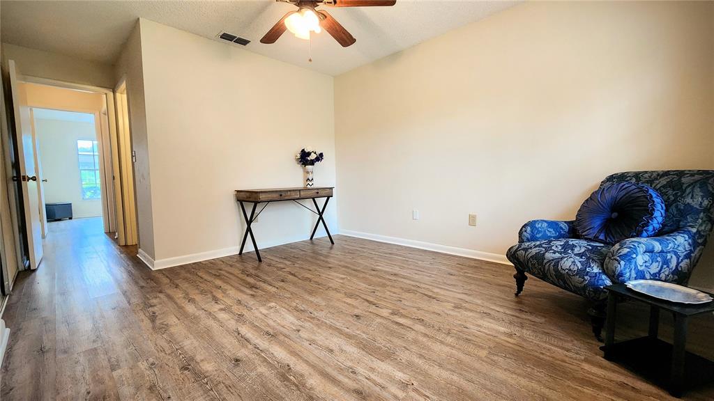 6440 Spring Flower Drive, Unit 14 New Port Richey, FL 34653 - Photo 14 of 35 a living room with furniture and a wooden floor