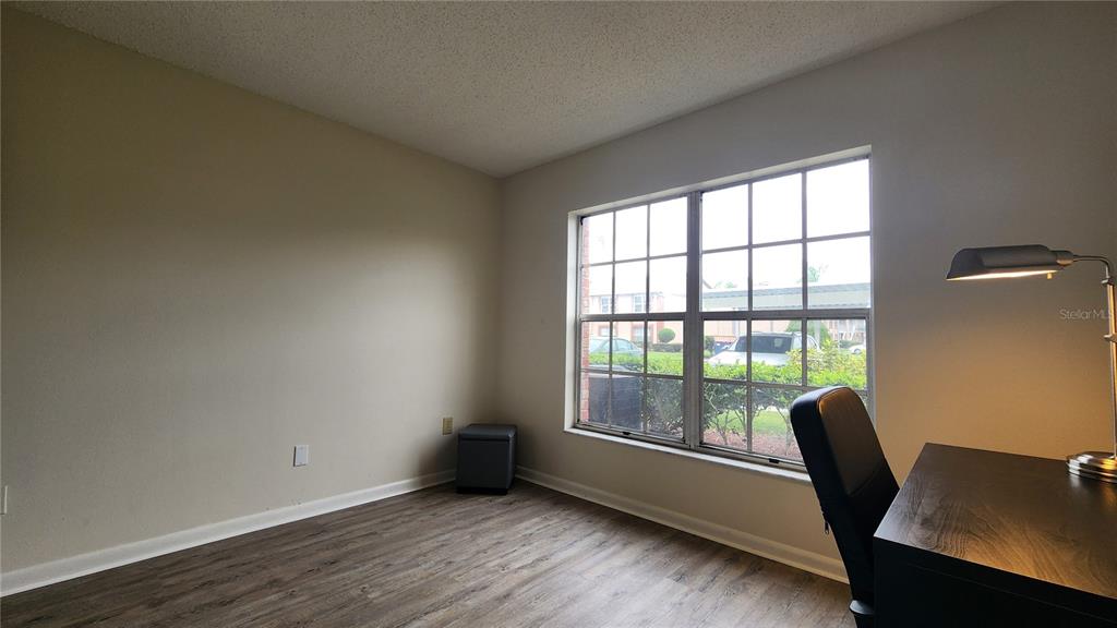 6440 Spring Flower Drive, Unit 14 New Port Richey, FL 34653 - Photo 15 of 35 a view of a workspace with furniture and a window