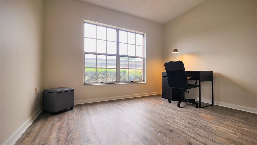 6440 Spring Flower Drive, Unit 14 New Port Richey, FL 34653 - Photo 16 of 35 a view of workspace with wooden floor and windows