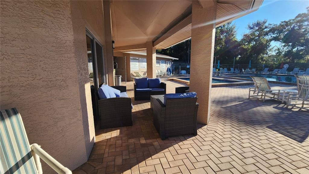 6440 Spring Flower Drive, Unit 14 New Port Richey, FL 34653 - Photo 21 of 35 a living room with furniture and a fireplace