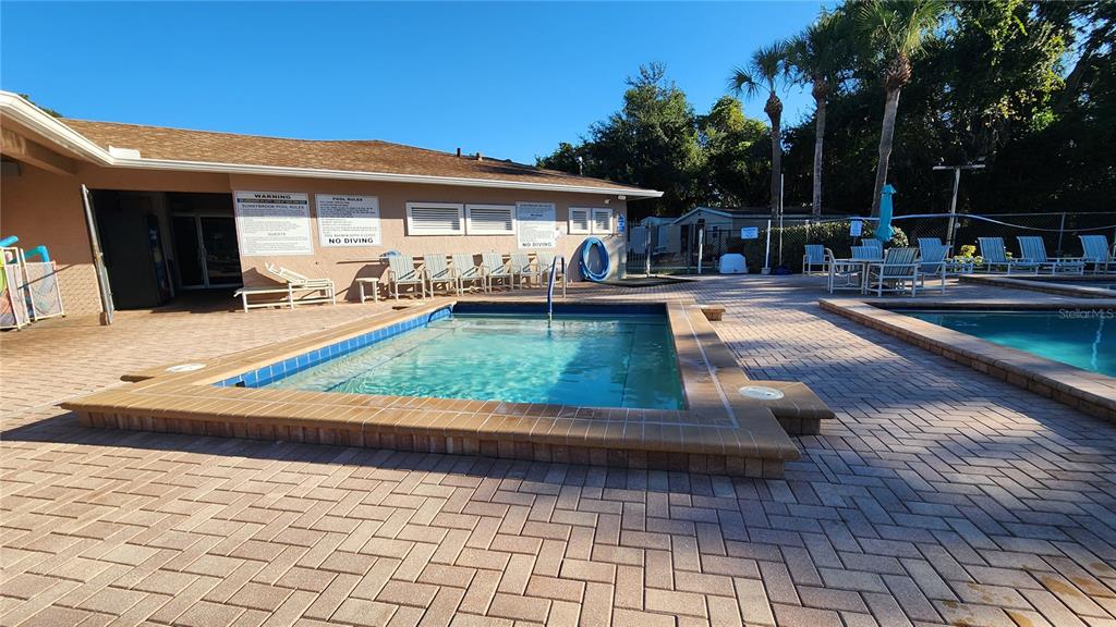 6440 Spring Flower Drive, Unit 14 New Port Richey, FL 34653 - Photo 26 of 35 a view of a house with backyard and sitting area