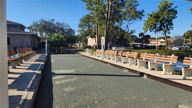 a view of a swimming pool with outdoor seating