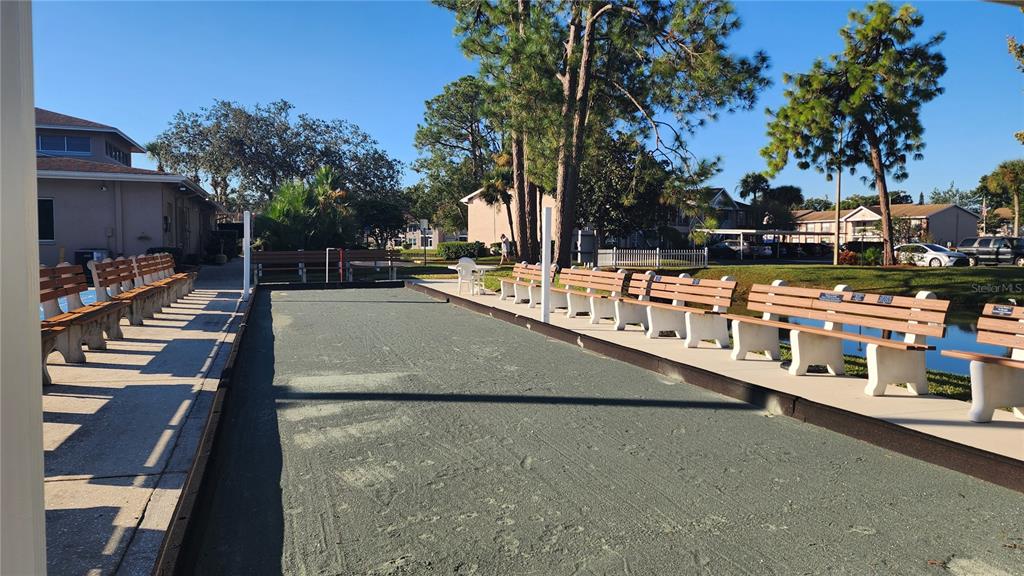 6440 Spring Flower Drive, Unit 14 New Port Richey, FL 34653 - Photo 30 of 35 a view of a swimming pool with outdoor seating
