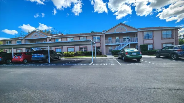 a view of a car parked in front of a building