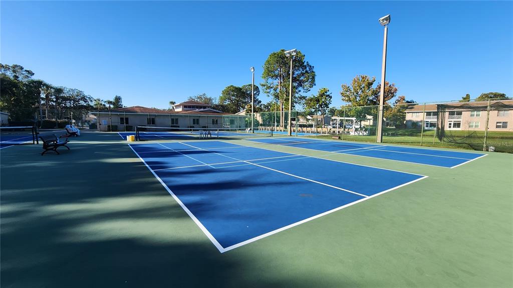 6440 Spring Flower Drive, Unit 14 New Port Richey, FL 34653 - Photo 31 of 35 a view of a tennis court
