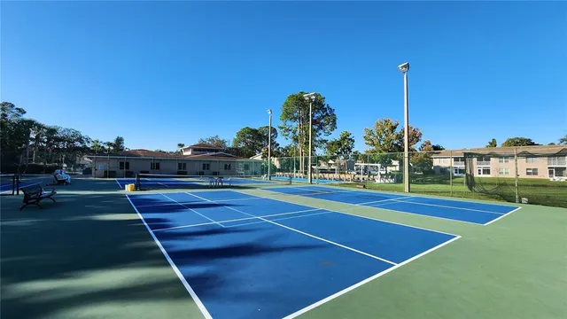 a view of an outdoor space and tennis court
