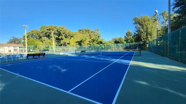 a view of an outdoor space and tennis court