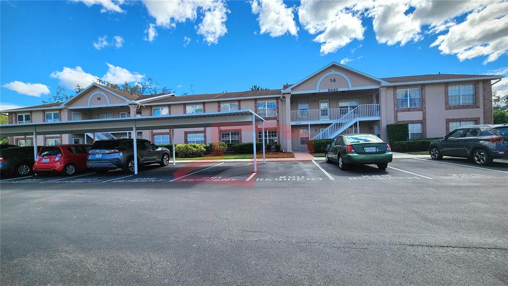 6440 Spring Flower Drive, Unit 14 New Port Richey, FL 34653 - Photo 4 of 35 a view of street with parked cars