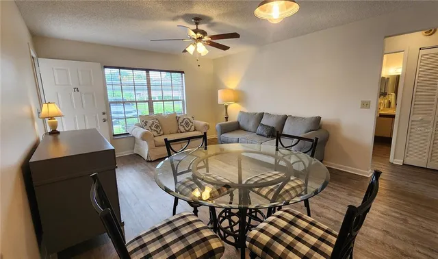 a view of a dining room with furniture window and wooden floor