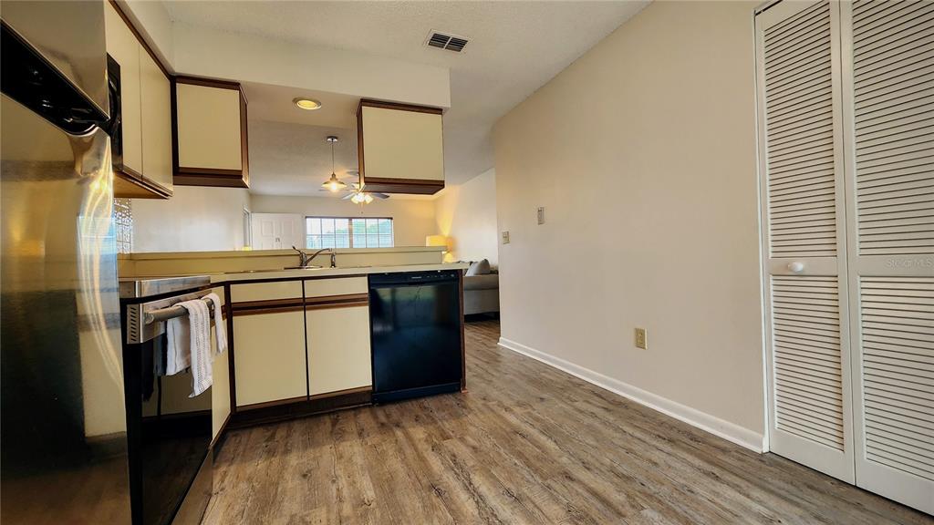 6440 Spring Flower Drive, Unit 14 New Port Richey, FL 34653 - Photo 10 of 35 a room with a sink and a stove top oven