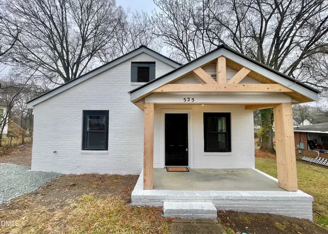 a front view of a house with yard