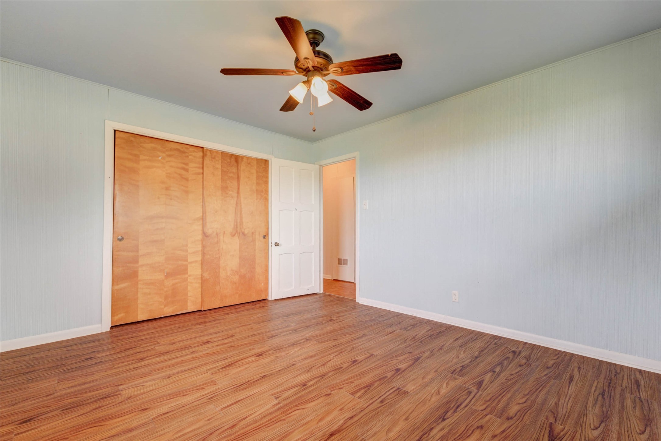 925 Norcross Road Wallis, TX 77485 - Photo 20 of 46 Generous proportions provide flexibility for a variety of furniture arrangements, while the spacious closet offers convenient storage for clothing and everyday essentials.