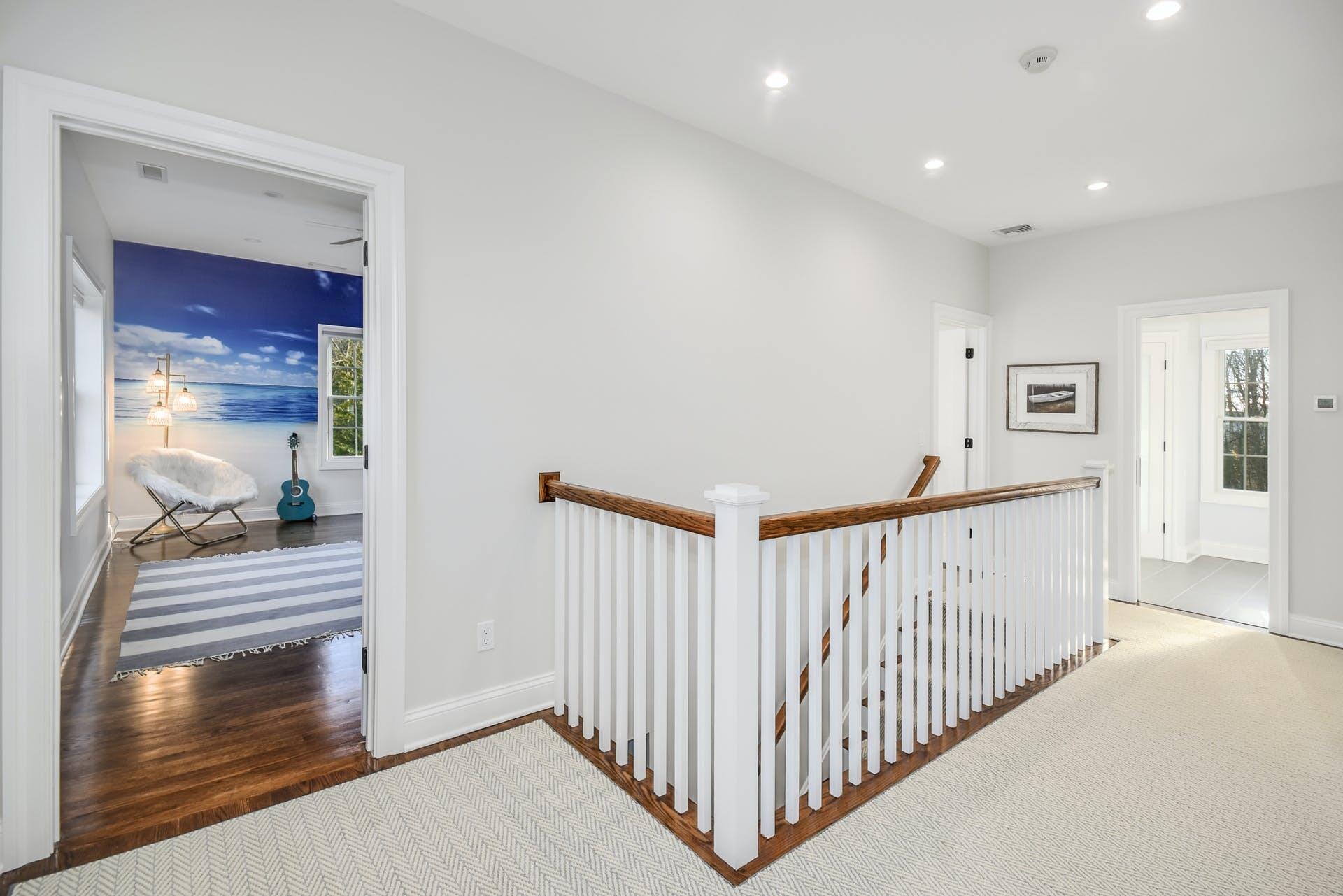 30 Country Club Road Darien, CT 06820 - Photo 23 of 39 a view of a hallway with wooden floor and windows
