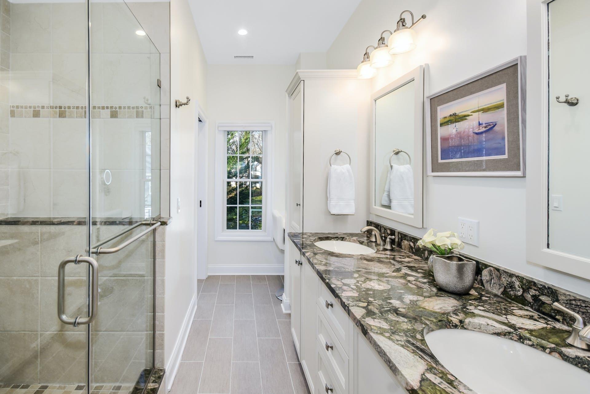 30 Country Club Road Darien, CT 06820 - Photo 27 of 39 a bathroom with a granite countertop sink mirror and a shower