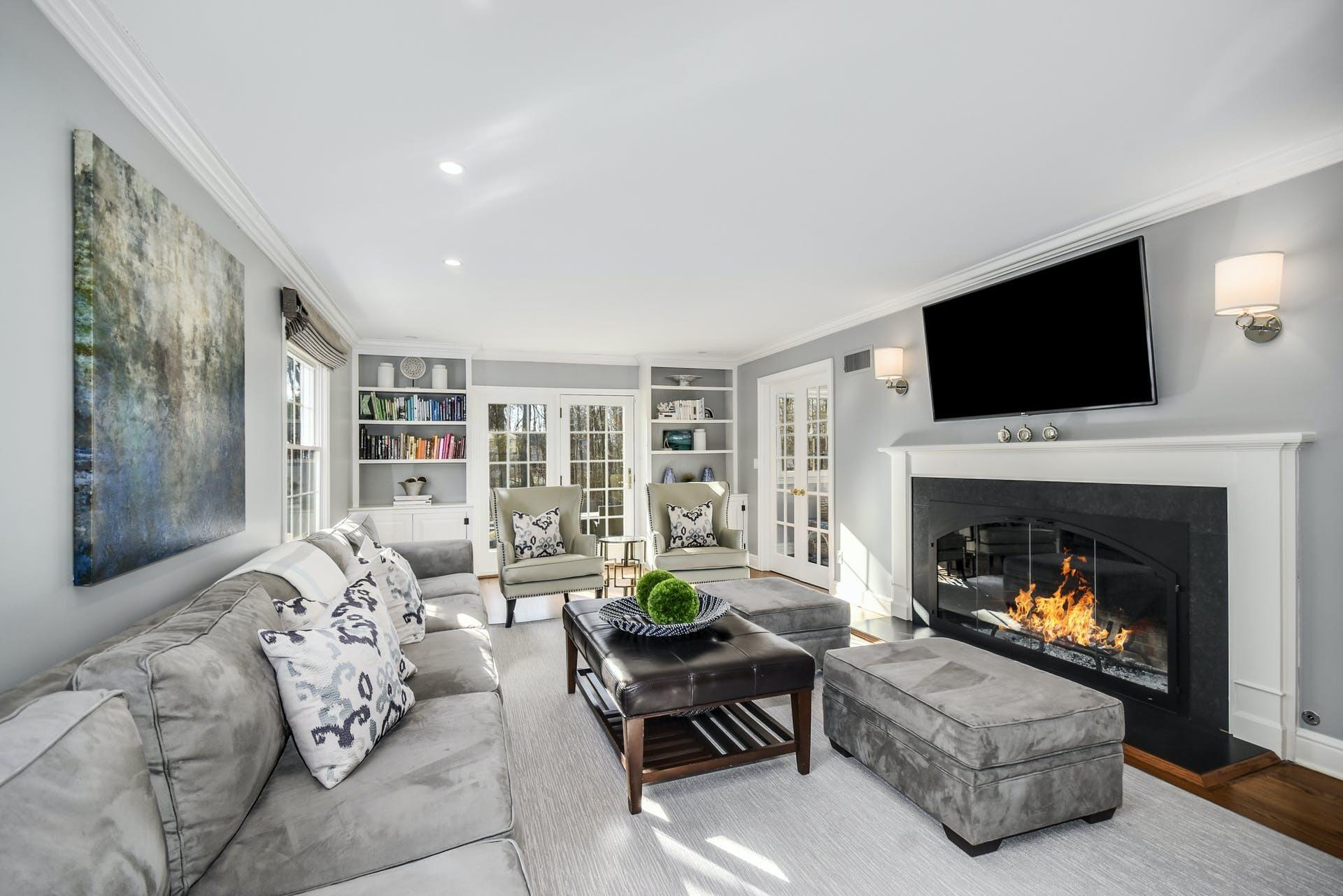 30 Country Club Road Darien, CT 06820 - Photo 4 of 39 a living room with furniture a flat screen tv and a fireplace