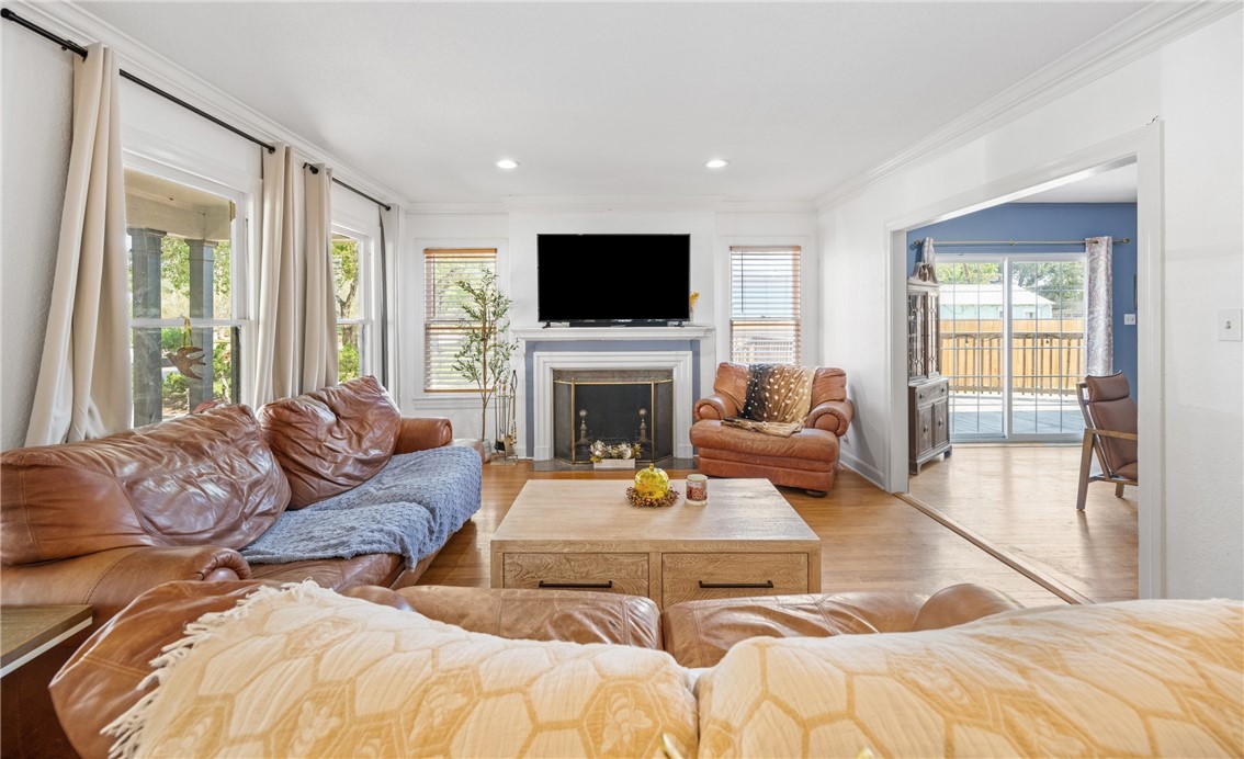 245 Leming Avenue Corpus Christi, TX 78404 - Photo 4 of 33 a living room with furniture fireplace and a flat screen tv