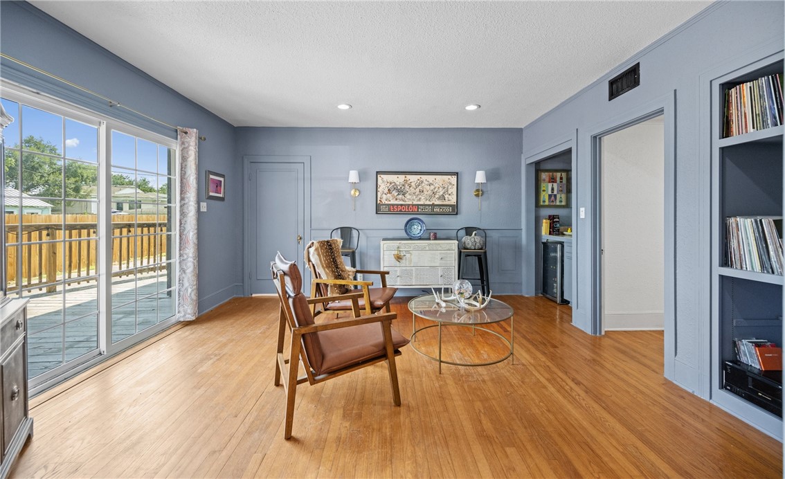 245 Leming Avenue Corpus Christi, TX 78404 - Photo 6 of 33 a living room with furniture and a flat screen tv