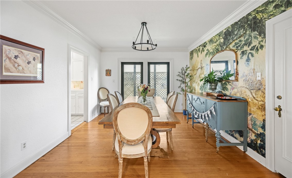 245 Leming Avenue Corpus Christi, TX 78404 - Photo 8 of 33 a view of a dining room with furniture window and wooden floor