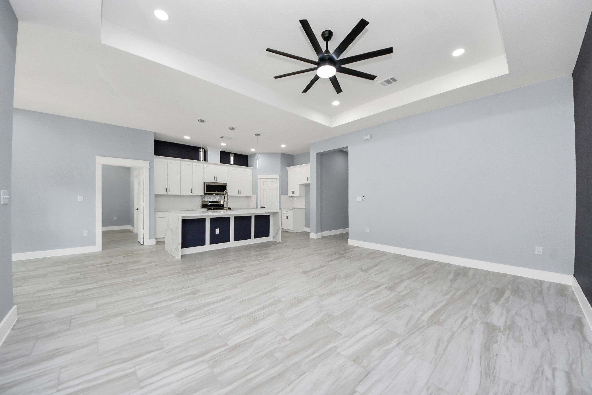 406 South Iowa Street La Porte, TX 77571 - Photo 13 of 49 an empty room with wooden floor and ceiling fan