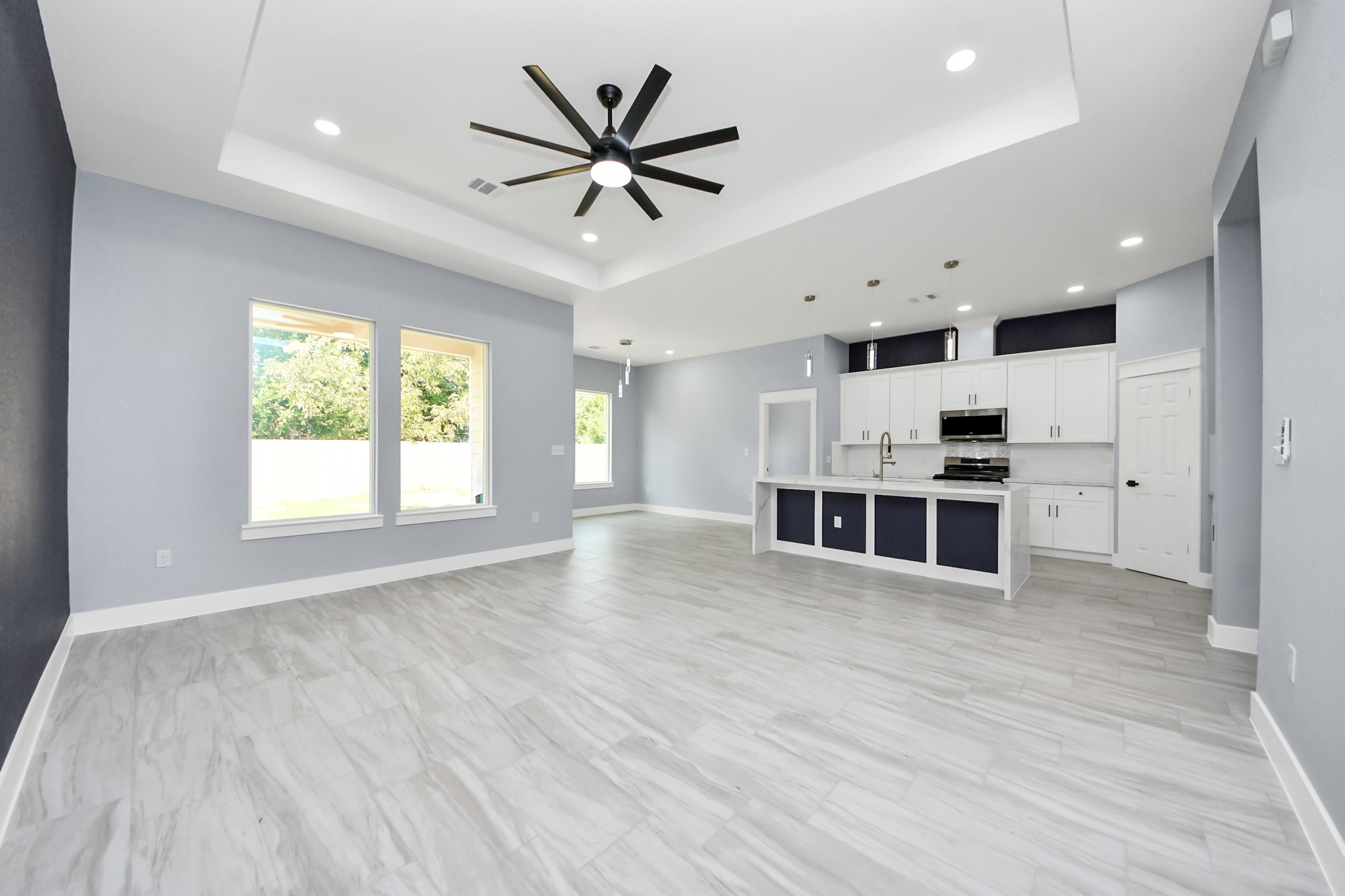406 South Iowa Street La Porte, TX 77571 - Photo 14 of 49 an empty room with wooden floor and windows