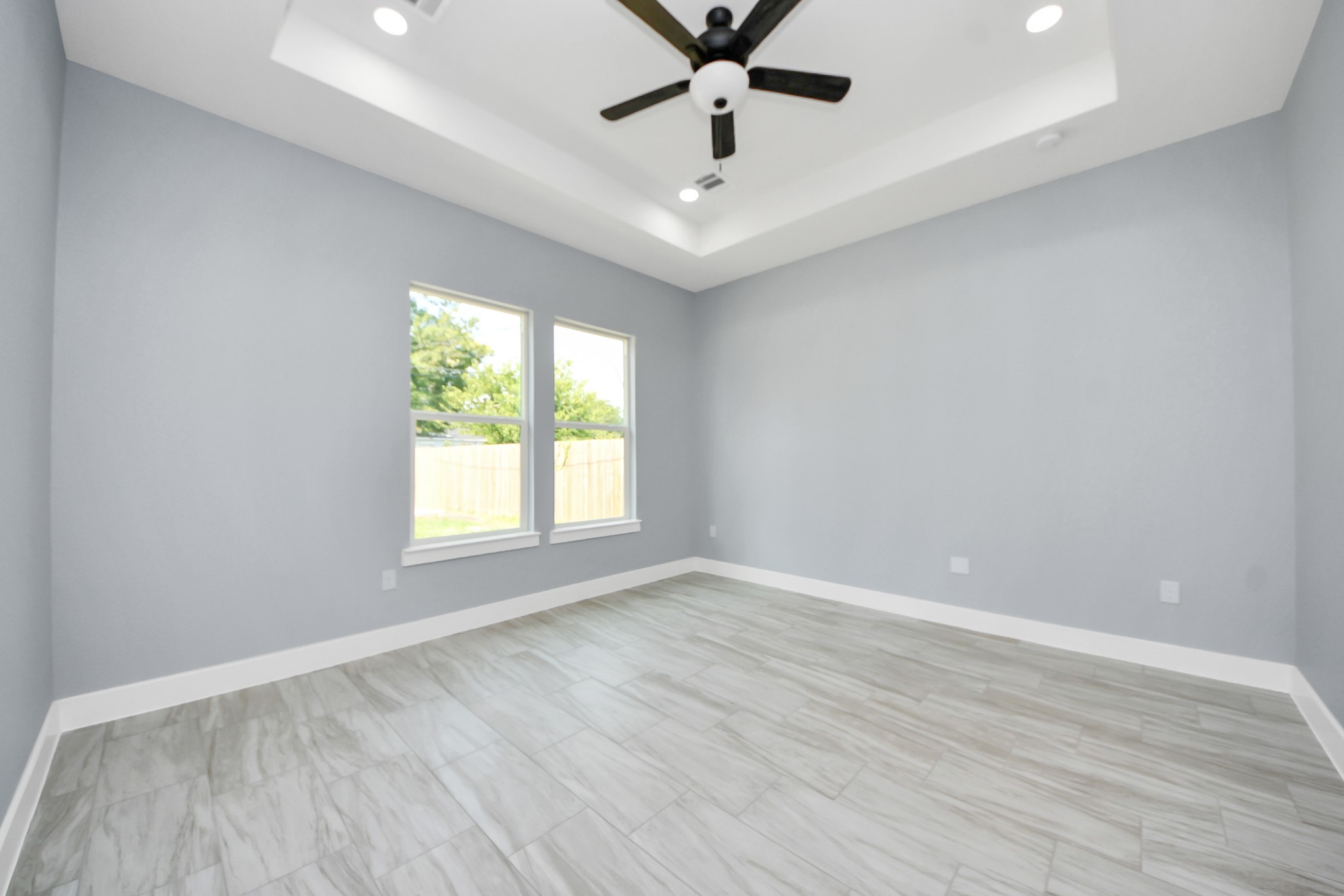406 South Iowa Street La Porte, TX 77571 - Photo 23 of 49 an empty room with wooden floor fan and windows
