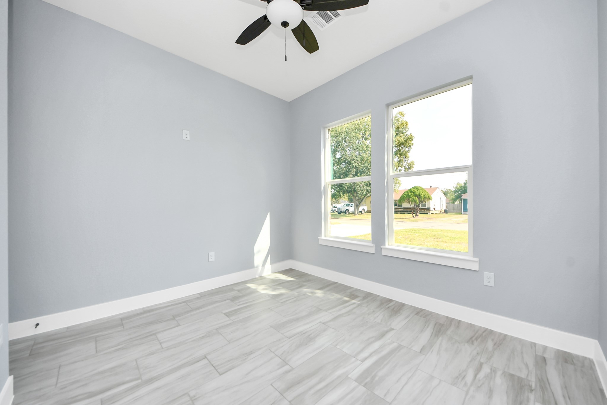 406 South Iowa Street La Porte, TX 77571 - Photo 25 of 49 wooden floor in an empty room with a window