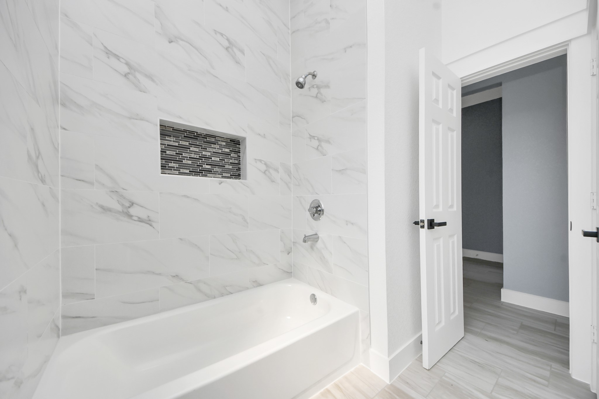 406 South Iowa Street La Porte, TX 77571 - Photo 38 of 49 a bathroom with a bathtub and a shower